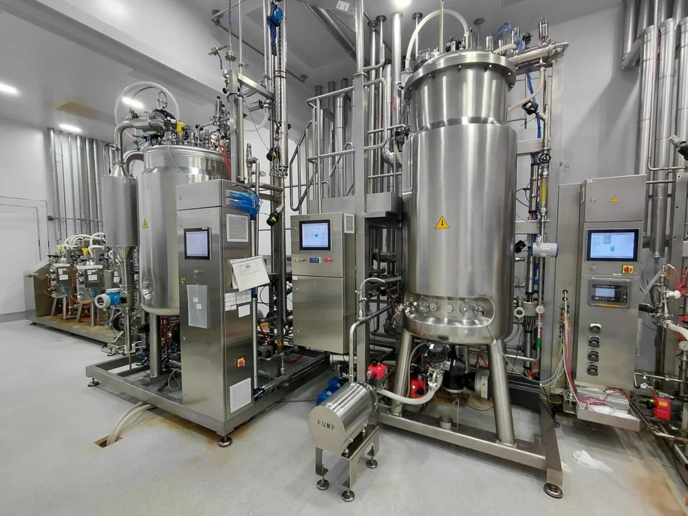 Stainless-steel bioreactor and filtration equipment in a process facility