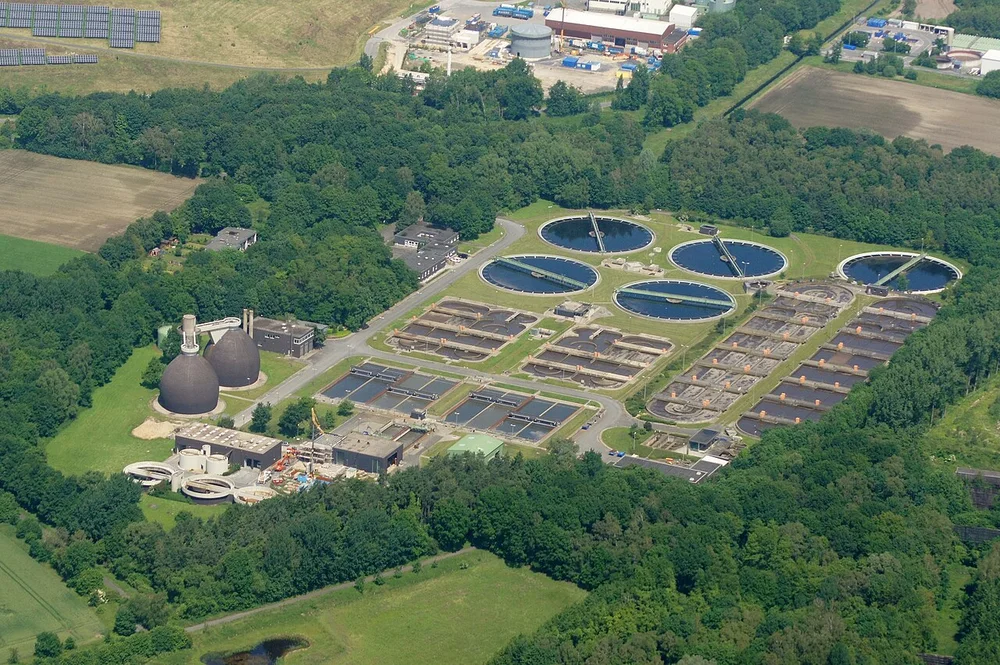 Aerial view of wastewater clarifiers, treatment basins and digesters
