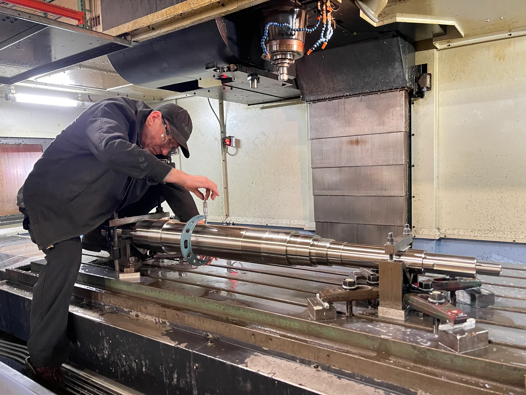 Technician setting up a component in a CNC machining center