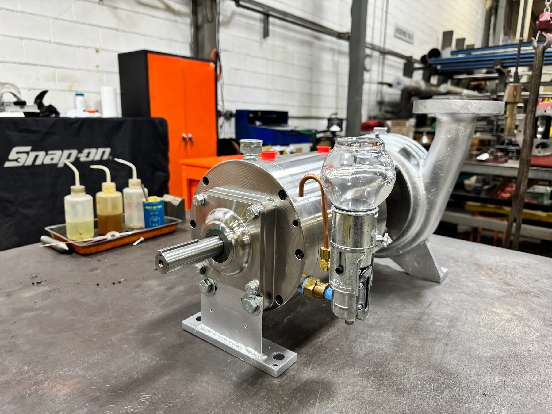 Custom metal components on a shop workbench